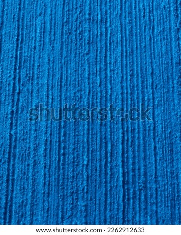 Texture of a plastered wall painted in blue. Concept background for your needs.