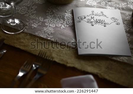 Close up shot of a menu on a table.