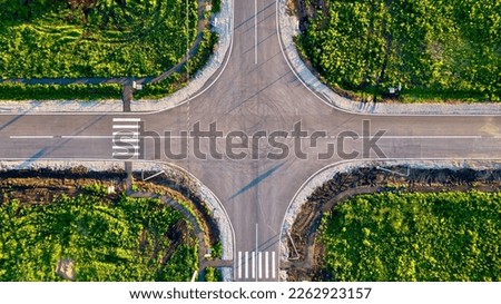  Aerial shot of a flat automobile intersection.  A flat road with markings. View from the height of the highway Royalty-Free Stock Photo #2262923157