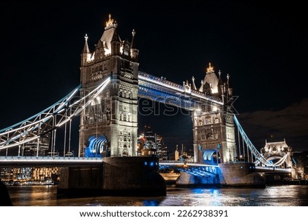 Tower Bridge Illuminated at Night, London's Iconic Landmark Lighting Up the River Thames