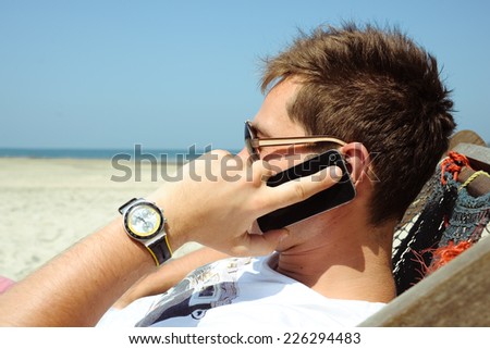 Young man talking by phone