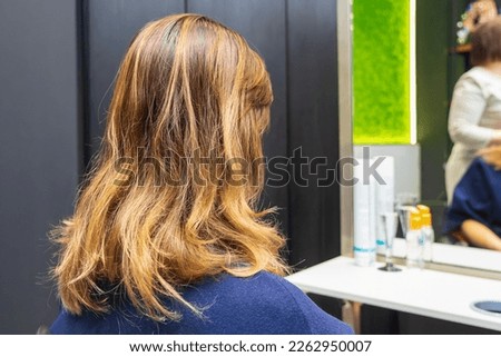 The process of creating hairstyles, hair care. Background with selective focus.