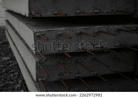 Stock concrete slabs. Concrete panels in row. Reinforced concrete with damaged and rusty metal fittings. hollow reinforced concrete slab with reinforcement. Royalty-Free Stock Photo #2262972981