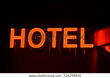 Neon sign of a small hotel.