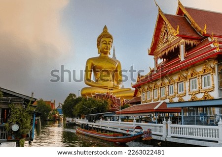 Big Buddha (Wat Paknam) at sunset. Chao Phraya river canal cruise. Tourists traveling by traditional boats. Thailand's most important travel destinations. Bangkok, Thailand
 Royalty-Free Stock Photo #2263022481