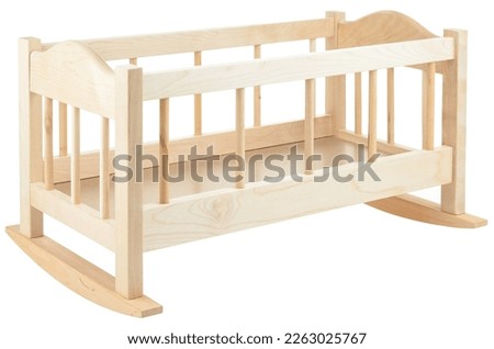 Wooden baby bed isolated on a white background. A toy crib for dolls. The frame of a lullaby, furniture for a children's room. Royalty-Free Stock Photo #2263025767