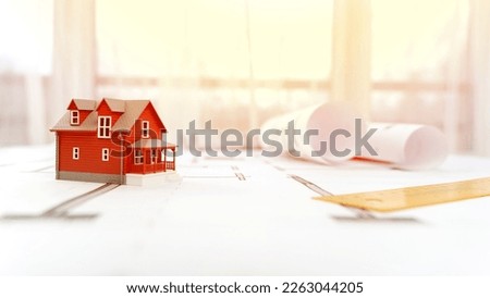 the model of the house on the design drawings. the concept of modern housing construction. High quality photo