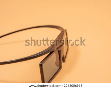 Three d glasses on an orange background. 3D glasses. Close-up.