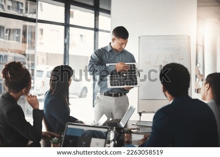 Man, solar panel and business presentation in office with investor group, ideas or future of earth. Businessman, renewable energy proposal or sustainability at workshop, brainstorming and development Royalty-Free Stock Photo #2263058519