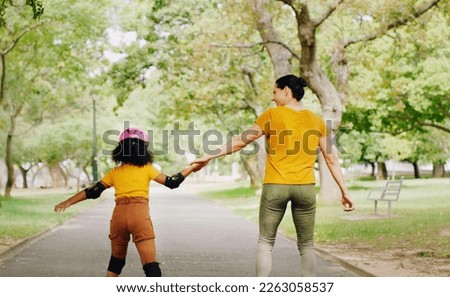 Mother, child and skating with roller skates at nature park for exercise, balance and freedom. Woman and black girl kid or family outdoor to play with helmet for safety, trust and love in summer