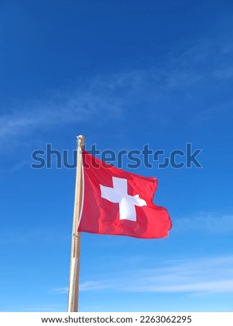 Swiss flag with a clear sky background