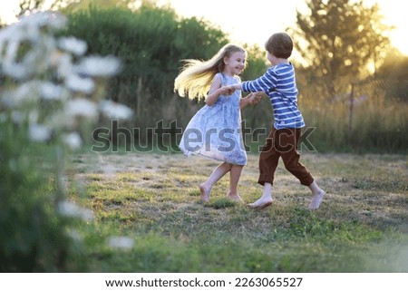 Children walk in the summer in nature. Child on a sunny spring morning in park. Traveling with children. Royalty-Free Stock Photo #2263065527