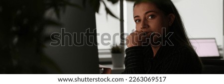 Portrait of tired pensive manager in dark office workplace