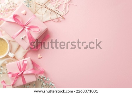 Saint Valentine's Day concept. Top view photo of pink present boxes white scarf stylish glasses cup of coffee small hearts and gypsophila flowers on isolated pastel pink background with copyspace