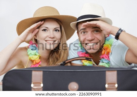 picture of a couple and their suitcase