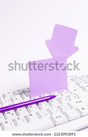Colored paper with important message lying desk near keyboard. Main information written on notebook. School supplies. Multiple Assorted Collection Office Stationery.