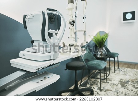 Machine, ophthalmology and laser in empty room of clinic for eye exam, laser and consulting. Healthcare, technology and interior with nobody in medical office for optometry, medicine and appointment Royalty-Free Stock Photo #2263102807