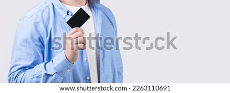 cropped view of guy holding business card. photo of guy hold business card. guy show business card