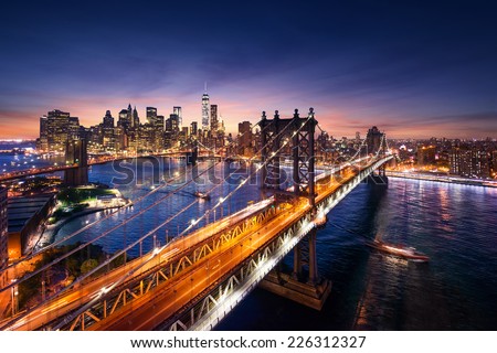 New York City - beautiful sunset over manhattan with manhattan and brooklyn bridge Royalty-Free Stock Photo #226312327