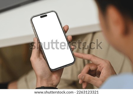 Man hand checking social media on mobile phone. Closeup view, blank screen for graphic display montage