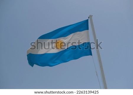 Argentina flag waving in the wind on sunny day. High quality photo