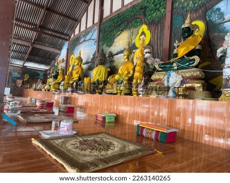 Prepare the seat for the Buddha image for giving alms to monks on Buddhist holy days.