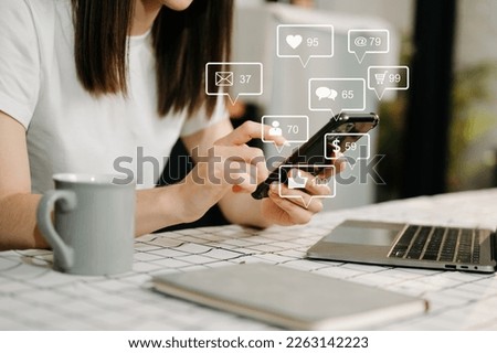 Social media and Marketing virtual icons screen concept.close up of businesswoman typing keyboard tablet with laptop computer  and smart phone in home
 Royalty-Free Stock Photo #2263142223