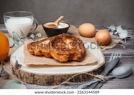 Torrijas. A typical Spanish sweet made with bread, milk, eggs, sugar, cinnamon and orange zest, consumed at Easter Royalty-Free Stock Photo #2263144589