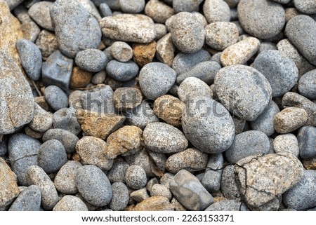 round rocks and pebbles on the beach in australia