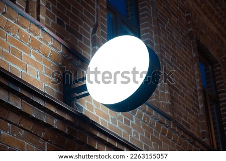 Place for signage on a white background. Brick wall in the evening. High quality photo