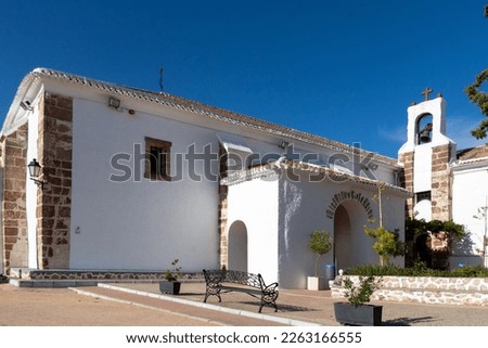Main facade of the beautiful spanish white hermitage, Ermita de la Virgen de Criptana on top of the hill in the village of Campo de Criptana, Ciudad Real, Spain Royalty-Free Stock Photo #2263166555