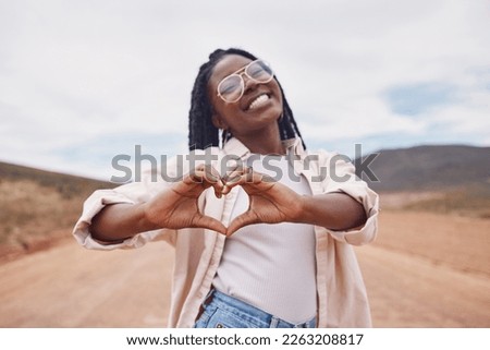 Happy, heart and hands with portrait of black woman in desert for freedom, smile and travel. Relax, happiness and sign with girl and positive gesture in nature for emoji, confidence and proud