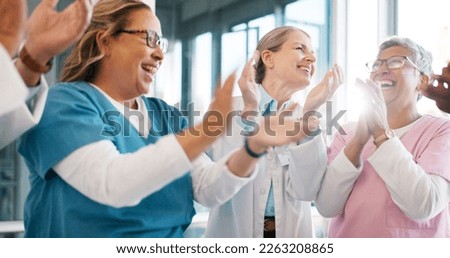 Doctor, support and applause in celebration for team unity, healthcare achievement or goal at the hospital. Group of medical professional clapping and celebrating teamwork, unity or victory at clinic