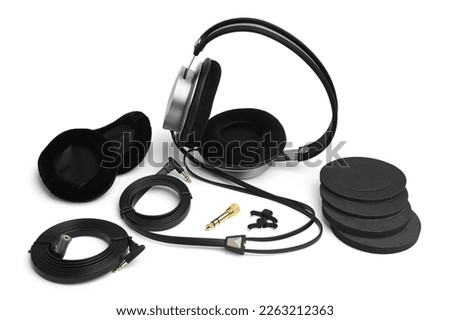 Big earphones with accessories on white background