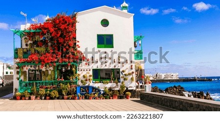 Lanzarote scenic places. Charming  Punta Mujeres traditional fishing village with floral streets and white houses. popular  for natural swim pools. Canary islands travel Royalty-Free Stock Photo #2263221807