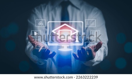 concept of learning course  electronic technology online, man hand showing graduation cap For Internet-based education courses or distance-learning formats. Royalty-Free Stock Photo #2263222239