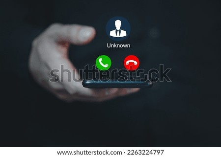 Unknown number calling in the middle of the night. Phone call from stranger. Man answering to incoming call. Phone call from unknown number. Call center gang, scammer or stranger. Royalty-Free Stock Photo #2263224797