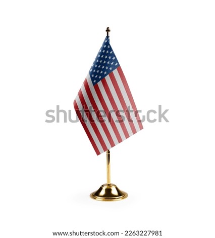 Small national flag of the USA on a white background. Royalty-Free Stock Photo #2263227981