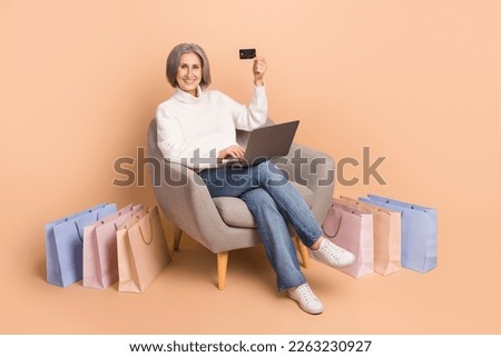 Full length photo of shiny cute lady dressed white sweater online shopping modern device empty space isolated beige color background