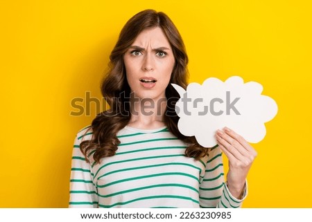 Photo portrait of lovely lady offended confused argument speech bubble cloud wear trendy striped look isolated on yellow color background