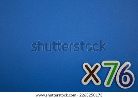 Colorful inscription ×76 placed on the lower right of the blue background.