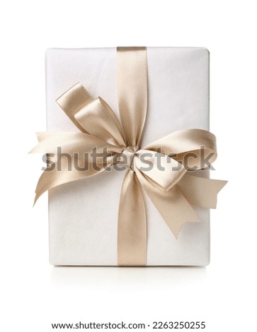 Gift box tied with satin ribbon isolated on white background Royalty-Free Stock Photo #2263250255