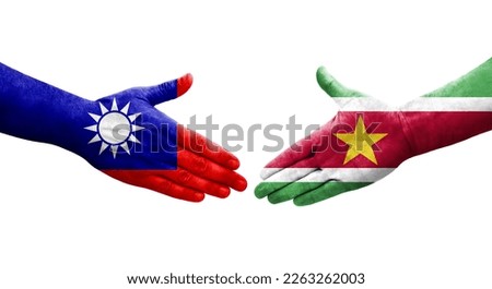 Handshake between Taiwan and Suriname flags painted on hands, isolated transparent image.