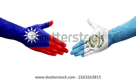 Handshake between Taiwan and Guatemala flags painted on hands, isolated transparent image.