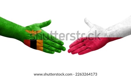 Handshake between Poland and Zambia flags painted on hands, isolated transparent image.
