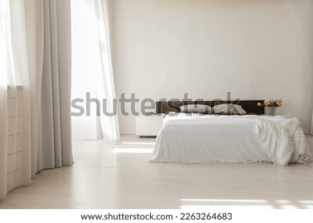double bed in bright room in the bedroom interior