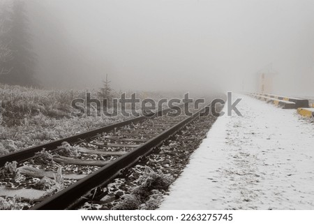 Icing on the rail, old track in mountains
