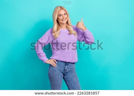 Photo of young charming attractive blonde hair lady showing like symbol thumb up vacancy wear stylish jumper isolated on cyan color background