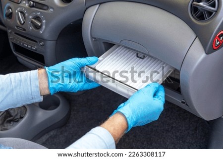 Replacing cabin pollen air filter for a car Royalty-Free Stock Photo #2263308117