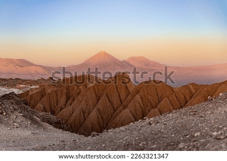 
Sunset on the desert mountains and volcano